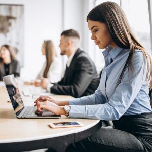 Group of people working out business plan in an office Group of people working out business plan in an office